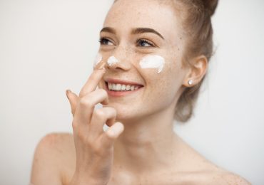 How do I apply sunscreen to my face to avoid wrinkles and discoloration?